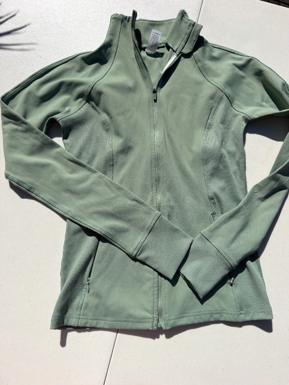 New without tags 90 Degree women full zip jacket with zipper and pocket. Green.